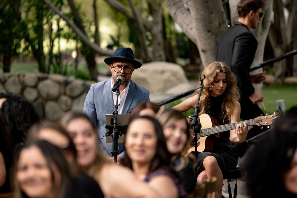 Music SD vocalists and an acoustic guitarist performing at an outdoor wedding